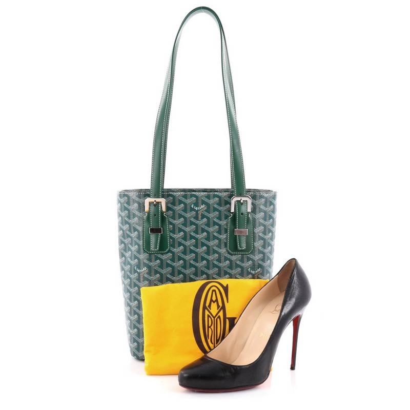 This authentic Goyard Marie Galante Handbag Coated Canvas PM exhibit a timeless elegance perfect for the stylish fashionista. Crafted from green chevron coated canvas, this classic and contemporary bag features dual flat leather shoulder straps with