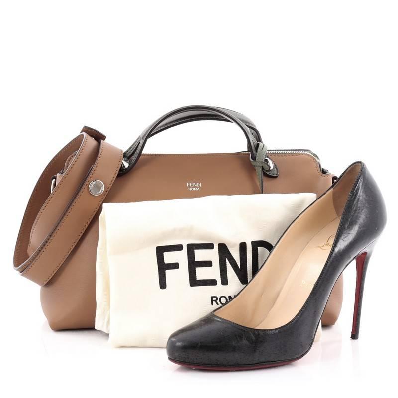 This authentic Fendi By The Way Satchel Calfskin Small, presented in the brand's 2014 Collection, showcases a modern, understated style admired by every fashionista. Constructed from brown calfskin leather with green leather trims, this minimalist