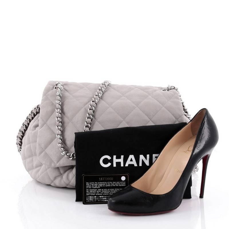 This authentic Chanel Chain Around Flap Bag Quilted Leather Large is a beautiful addition to your collection. Crafted in light gray quilted leather, this soft pleated flap features woven-in leather chain straps with chain-around design, frontal flap