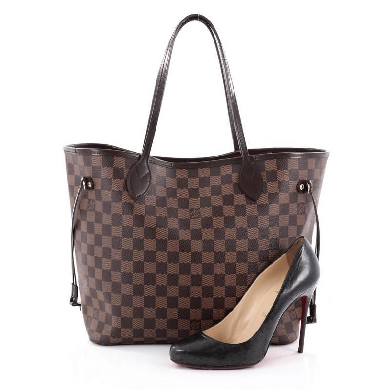 This authentic Louis Vuitton Neverfull NM Tote Damier MM is a popular and practical oversized tote beloved by many. Constructed with Louis Vuitton's signature damier ebene coated canvas, this tote features dual slim vachetta handles, side laces can