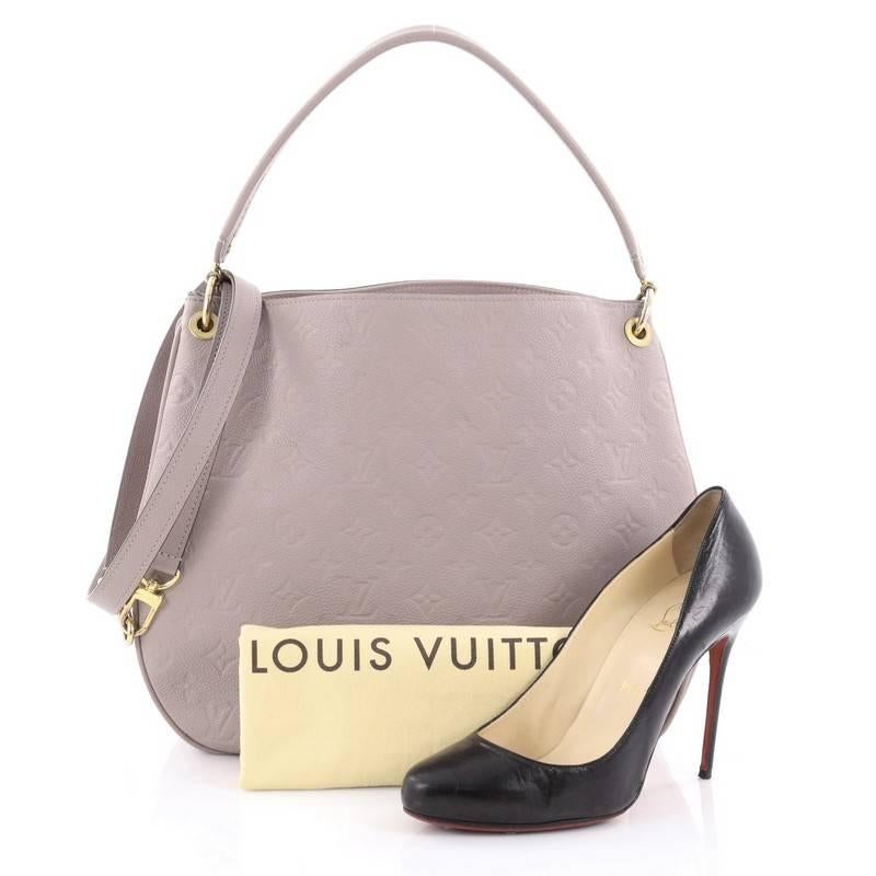 This authentic Louis Vuitton Spontini NM Handbag Monogram Empreinte Leather is a sporty and feminine bag, specifically crafted for the urban lifestyle. Crafted from lavender monogram empreinte leather, this lightweight bag features flat leather