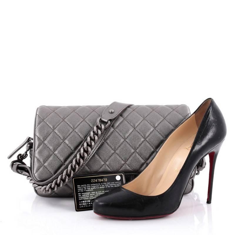 This authentic Chanel Airlines Chain Handle Flap Bag Quilted Goatskin Small is a chic and stylish bag made for all Chanel lovers. Crafted in metallic gray quilted goatskin in its signature diamond quilted design, this sophisticated flap bag features