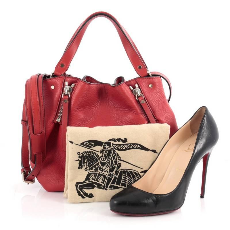 This authentic Burberry Maidstone Convertible Satchel Leather and House Check Canvas Small showcases a sophisticated design made for everyday use. Constructed from red leather, this chic soft-structured satchel features the signature Burberry house