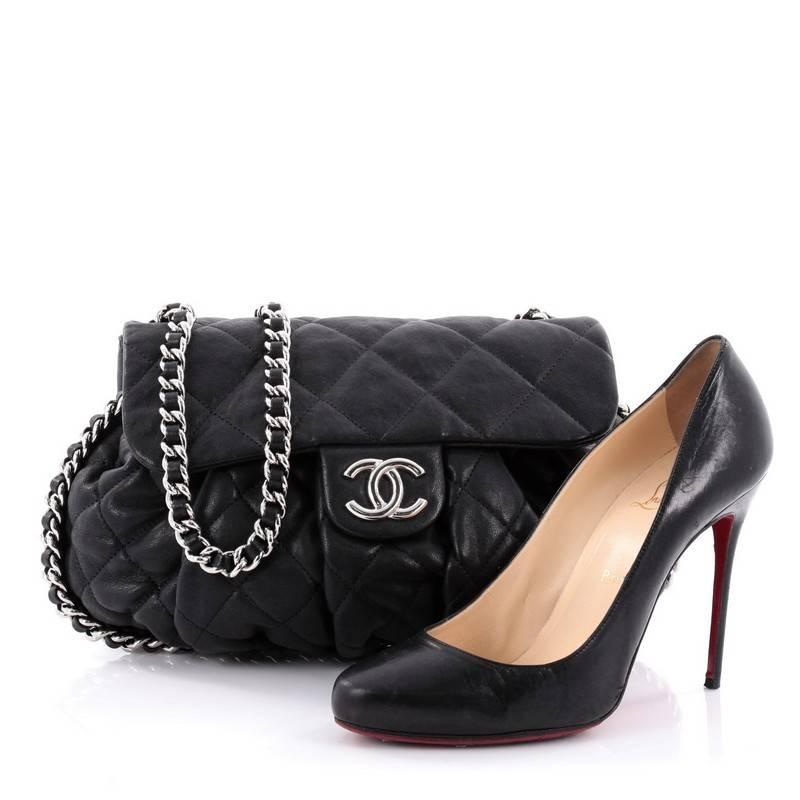 This authentic Chanel Chain Around Flap Bag Quilted Leather Medium is a beautiful piece to add to your collection. Crafted in black quilted leather, this soft pleated flap bag features woven-in leather chain straps with an all-around design, frontal