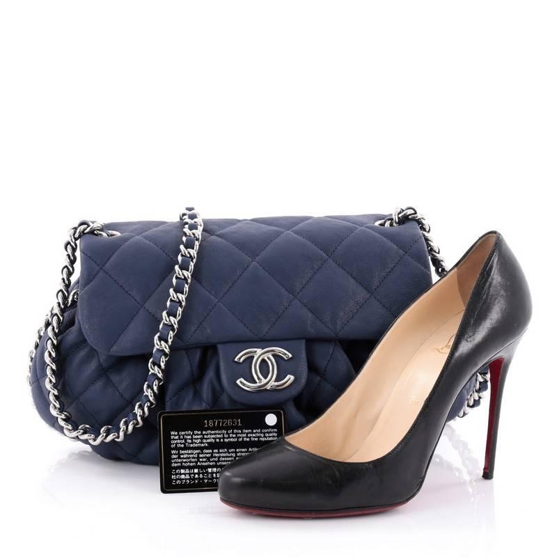 This authentic Chanel Chain Around Flap Bag Quilted Leather Medium is a beautiful piece to add to your collection. Crafted in blue quilted leather, this soft pleated flap bag features woven-in leather chain straps with an all-around design, frontal