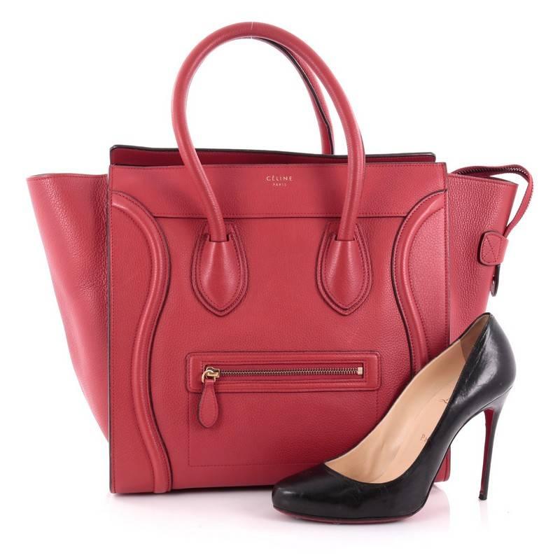 This authentic Celine Luggage Handbag Grainy Leather Mini epitomizes Phoebe Philo's minimalist yet chic style. Constructed in red grainy leather, this beloved fashionista's bag features dual-rolled leather handles, a frontal zip pocket, Celine's