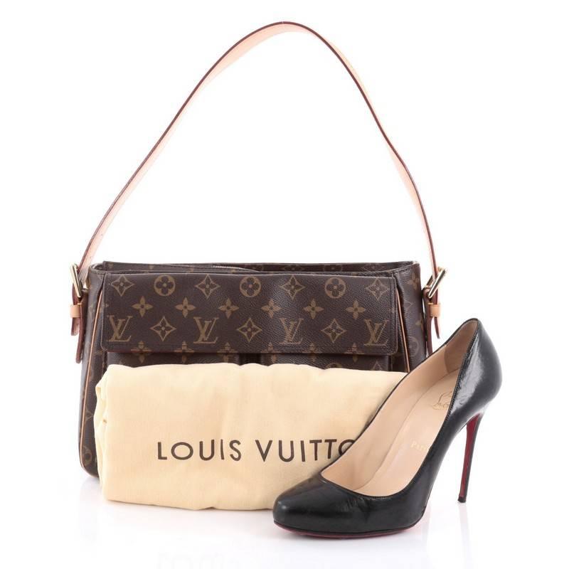 This authentic Louis Vuitton Viva Cite Handbag Monogram Canvas GM showcases a simple design made for everyday use. Crafted from brown monogram coated canvas, this satchel features an adjustable cowhide shoulder strap, vachetta leather trims, two