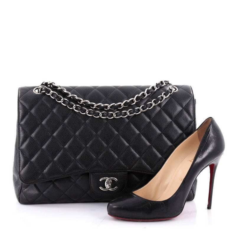 This authentic Chanel Classic Single Flap Bag Quilted Caviar Maxi is a timeless essential for any modern woman. Crafted in black quilted caviar leather, this classic flap features woven-in leather chain strap, exterior back pocket, CC signature