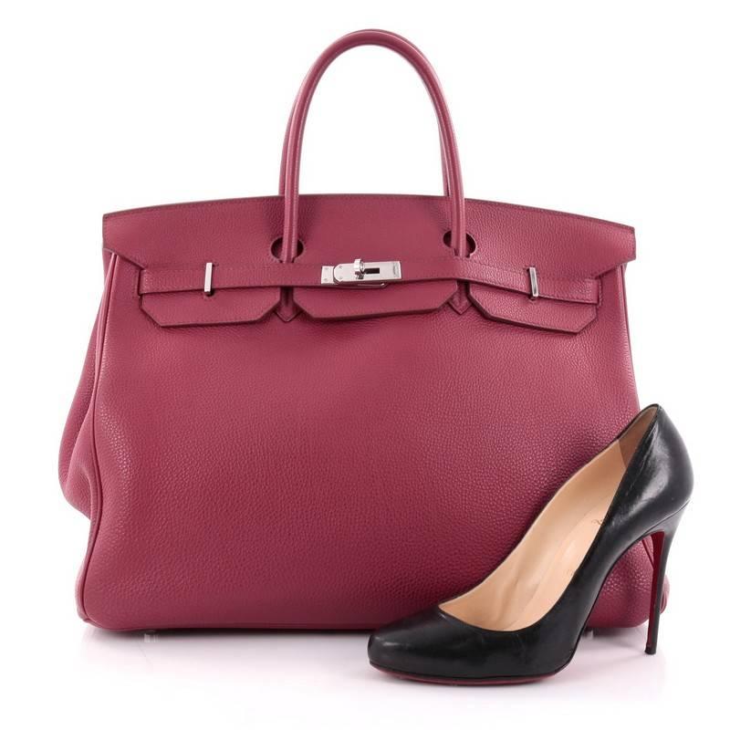 This authentic Hermes Birkin Handbag Rubis Togo with Palladium Hardware 40 stands as one of the most-coveted bags fit for any fashionista. Constructed from sturdy, scratch-resistant rubis red togo leather, this stand-out oversized tote features