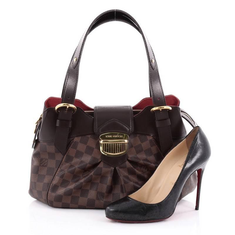 This authentic Louis Vuitton Sistina Handbag Damier PM is perfect for everyday use. Crafted from damier ebene coated canvas, this stylish, feminine bag features center pleating, smooth brown leather trims, dual flat buckle shoulder straps, and