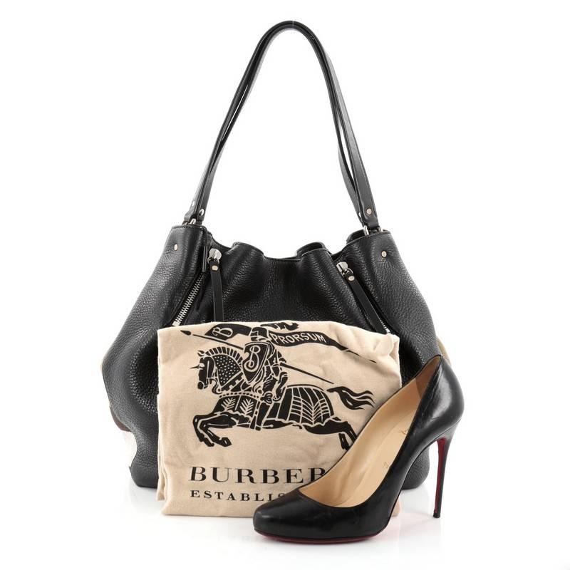 This authentic Burberry Maidstone Tote Leather and House Check Canvas Medium showcases a sophisticated design made for everyday use. Constructed from black leather, this chic soft-structured satchel features the signature Burberry house check canvas