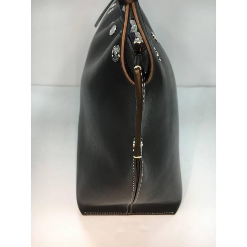 This authentic Celine Sailor Bag Studded Leather Medium is from the brands Resort 2016 that perfect for your day or evening looks. Crafted from navy blue leather with stud detailing, this stylish bag features slim leather shoulder strap with knotted