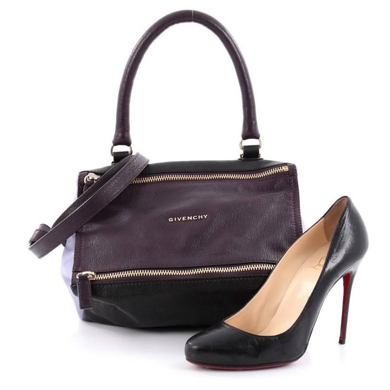 This authentic Givenchy Pandora Bag Leather Small is the perfect companion for any on-the-go fashionista. Crafted from purple, lavender and black leather, this edgy and cult-favorite satchel features a pandora box-inspired silhouette, a rolled top