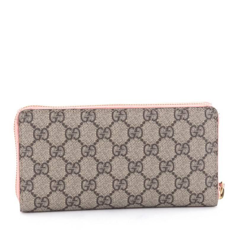 Gucci Zip Around Wallet GG Coated Canvas with Face Applique In Good Condition In NY, NY