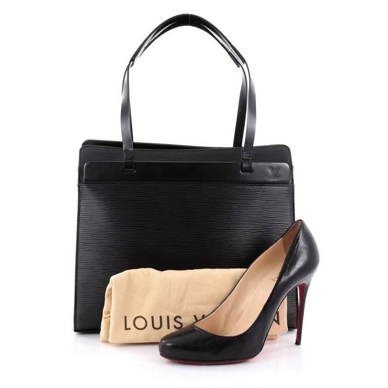 
This authentic Louis Vuitton Croisette Handbag Epi Leather PM is refined and elegantly constructed ideal for everyday excursions. Crafted from Louis Vuitton's signature sturdy black epi leather, this bag features long thin leather straps, subtle LV