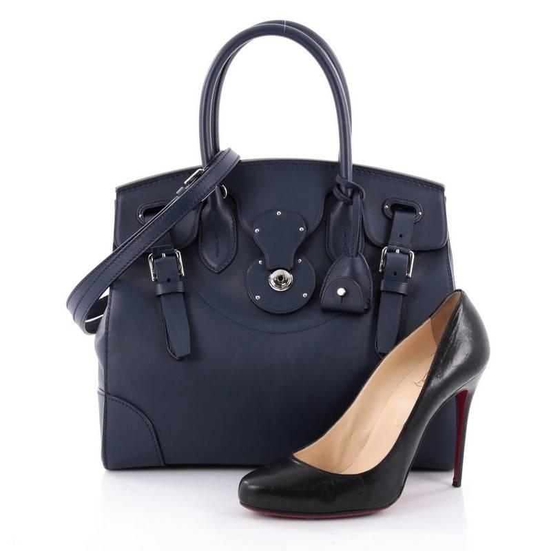 This authentic Ralph Lauren Collection Soft Ricky Handbag Leather 33 is one of the brand's most beloved styles. Crafted from blue leather, this understated, elegant tote features a boxy silhouette, a folded top with a slide-lock clasp and belted