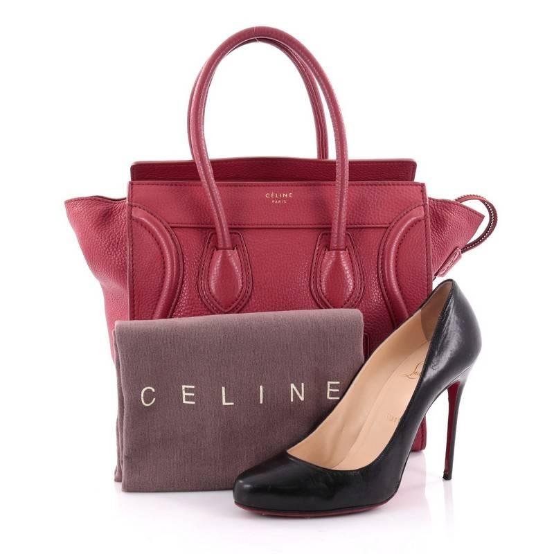 This authentic Celine Luggage Handbag Grainy Leather Micro is one of the most sought-after bags beloved by fashionistas. Crafted from red grainy leather, this minimalist tote features dual-rolled handles, an exterior front pocket, stamped logo at