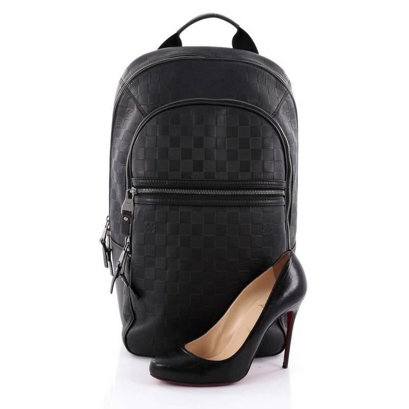 This authentic Louis Vuitton Michael NM Backpack Damier Infini Leather is a lightweight, luxe backpack combining style and comfort. Crafted from damier infini leather, this chic, hands-free backpack features a short flat leather top handle, two