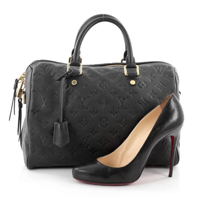 This authentic Louis Vuitton Speedy Bandouliere Bag Monogram Empreinte Leather 30 is a modern must-have. Constructed from Louis Vuitton's luxurious navy blue monogram embossed empreinte leather, this iconic and re-imagined Speedy features