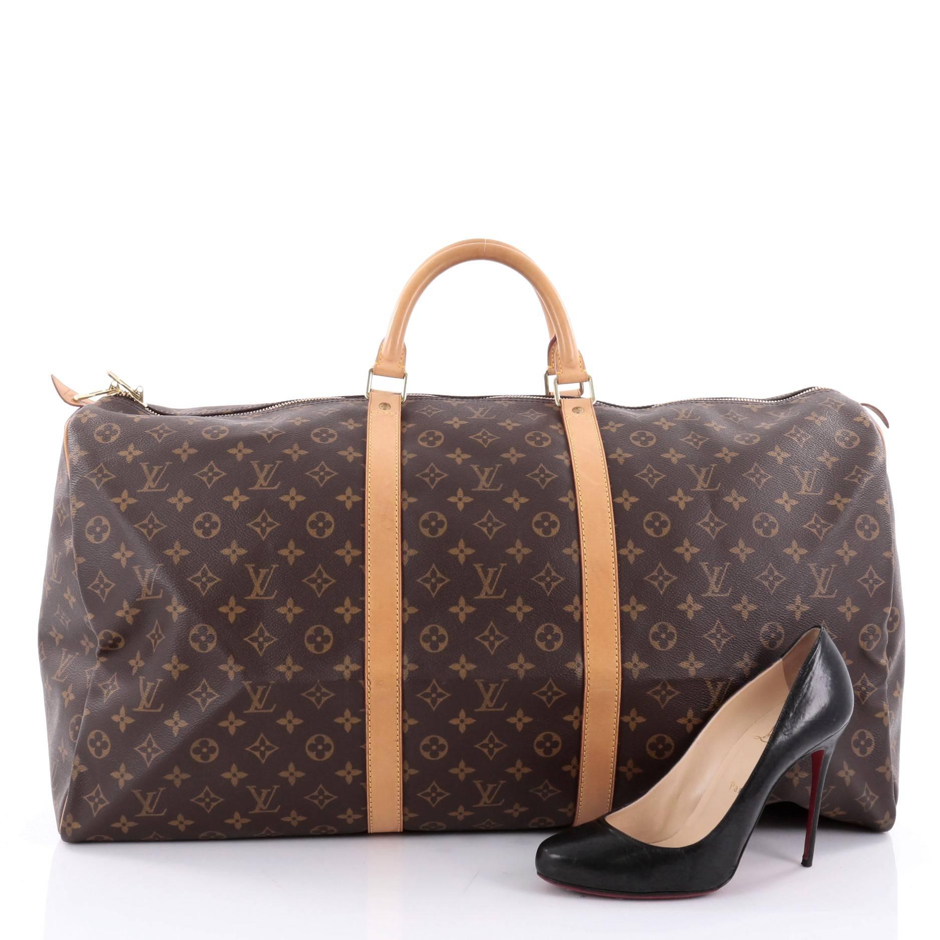 This authentic Louis Vuitton Keepall Bag Monogram Canvas 60 is the perfect purchase for a weekend trip, and can be effortlessly paired with any outfit from casual to formal. Crafted with traditional Louis Vuitton brown monogram coated canvas, this