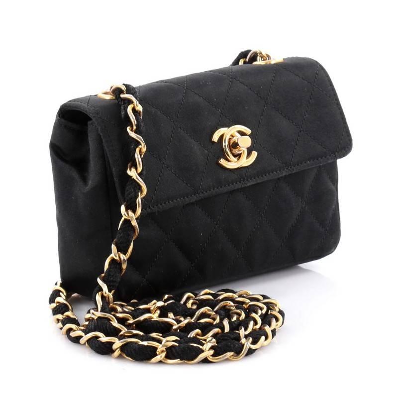 This authentic Chanel Vintage CC Chain Flap Bag Quilted Satin Extra Mini is surely an added piece to any Chanel lover. Crafted in black quilted satin, this flag bag features woven in satin chain link strap, CC turn-lock closure and gold-tone