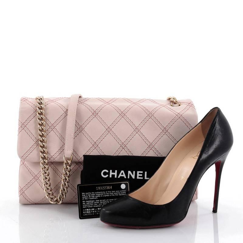 This authentic Chanel Metallic Stitch Flap Bag Quilted Leather Medium is a fun and ladylike bag from the brands Pre-Spring 2014 Collection. Crafted from light pink leather with pink and metallic stitching, this versatile bag features a chain-link
