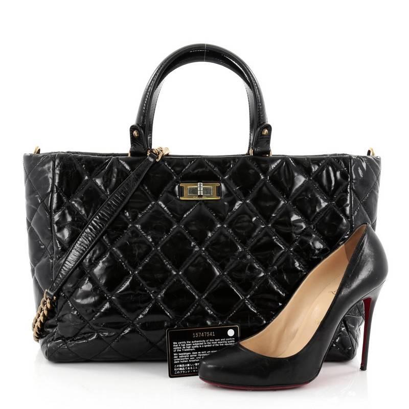 This authentic Chanel Rita Tote Quilted Glazed Crackled Calfskin Small presents a classic and timeless style made for any fashionista. Constructed in luxurious diamond quilted distressed calfskin leather, this chic, tote features dual-flat leather