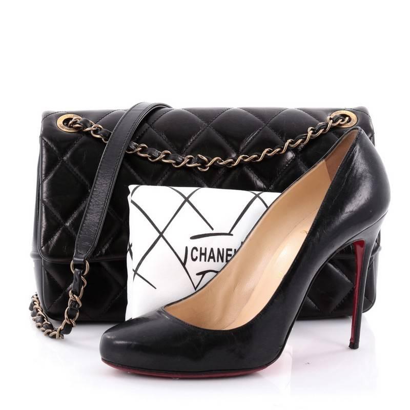 This authentic Chanel Paris-Salzburg CC Flap Bag Quilted Calfskin Small is an avant-garde collector's piece made for Chanel collectors. Crafted from black quilted calfskin leather, this luxurious, runway-ready bag features woven-in felt chain strap,
