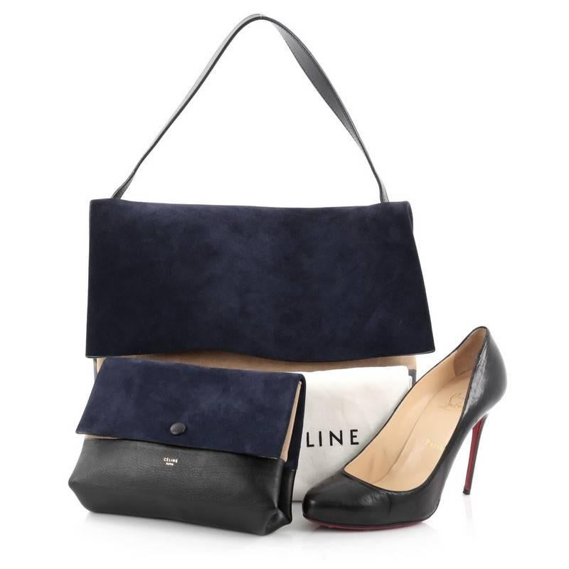 This authentic Celine All Soft Tote Suede is an understated look perfect for the modern woman. Crafted in beige and blue suede and black leather, this fresh, minimalist tote features a single leather shoulder strap, subtle stamped Celine logo and