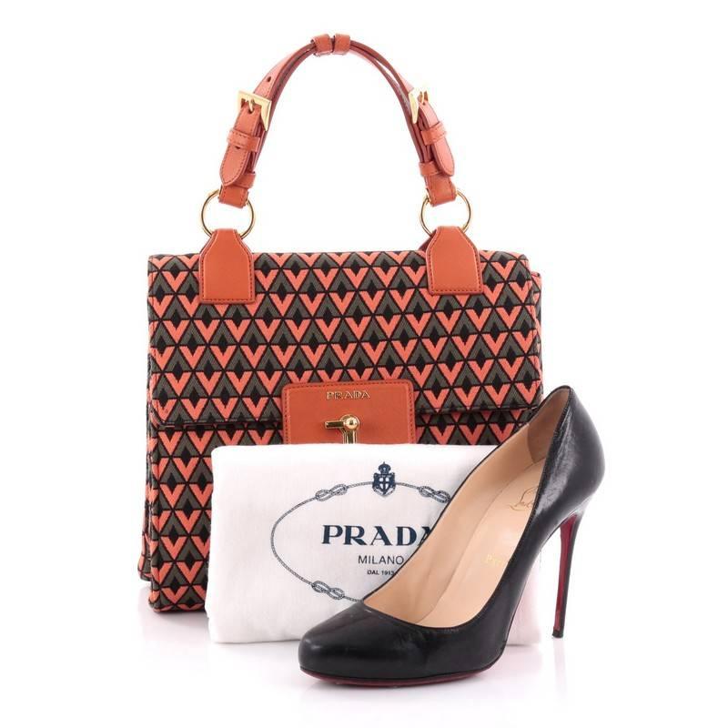 This authentic Prada Top Handle Box Bag Printed Jacquard Medium is from the brands' 2012 Collection perfect for your day or nights out. Crafted from orange and green ginestra diamond printed jacquard, this bag features leather top handles, orange