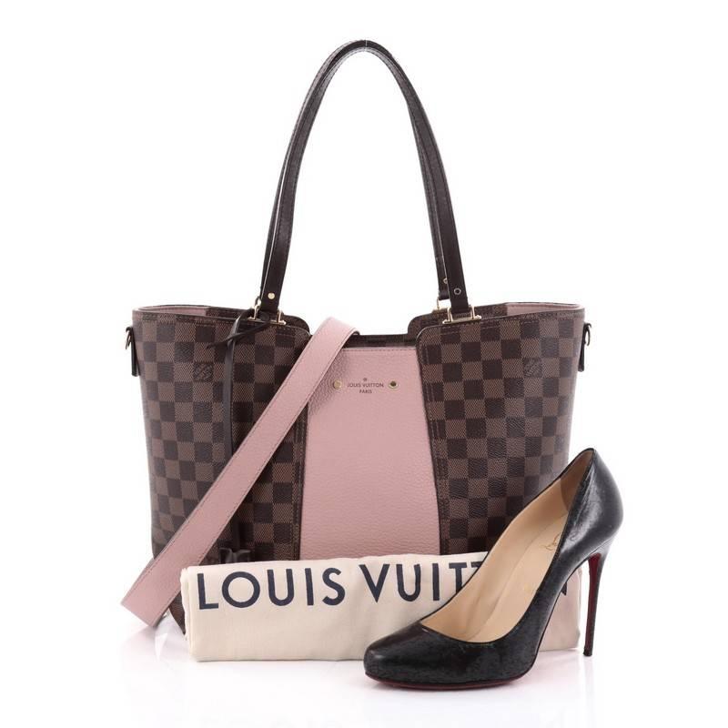 This authentic Louis Vuitton Jersey Handbag Damier Canvas with Leather is the epitome of casual chic. Crafted from brown damier ebene coated canvas and pink leather, this perfect daily bag features dual flat leather handles, detachable strap,
