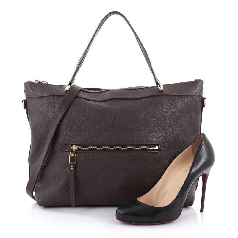 This authentic Louis Vuitton Bastille Bag Monogram Empreinte Leather MM is luxurious and sophisticated perfect for everyday use. Crafted in dark brown monogram empreinte leather, this elegant city tote features dual-leather handles, exterior zip