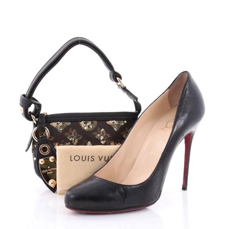 This authentic Louis Vuitton Pochette Limited Edition Monogram Eclipse Sequins Mini presented in the brand's 2009-2010 Collection is a luxurious, petite clutch ideal for evening looks. Crafted from brown monogram coated canvas with gold sequins