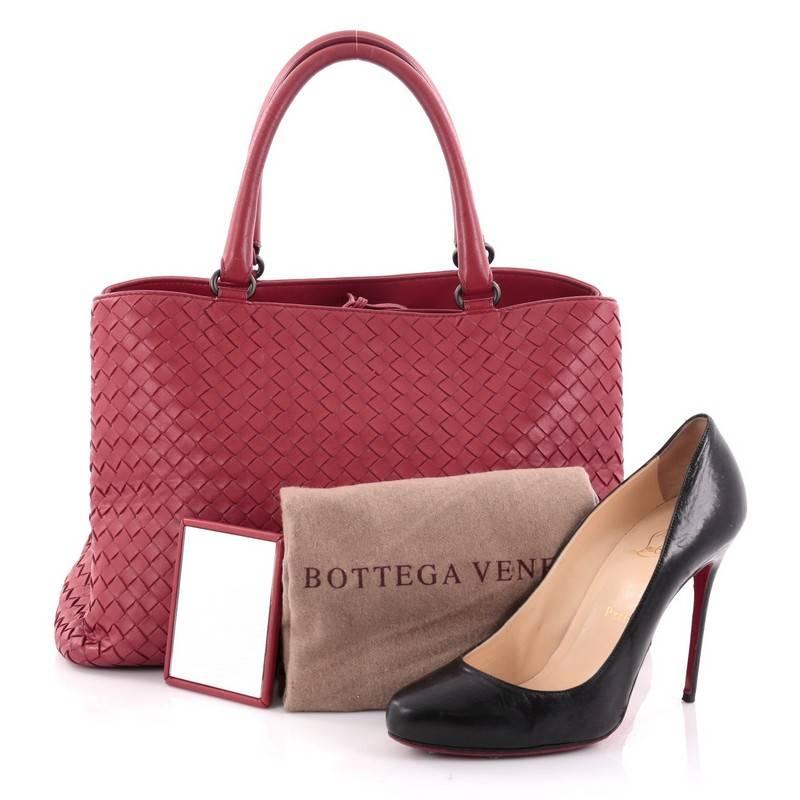 This authentic Bottega Veneta Milano Tote Intrecciato Nappa Large is a timeless, versatile piece you can surely take from day to night. Beautifully crafted in red nappa leather in Bottega Veneta's signature intrecciato woven method, this stylish