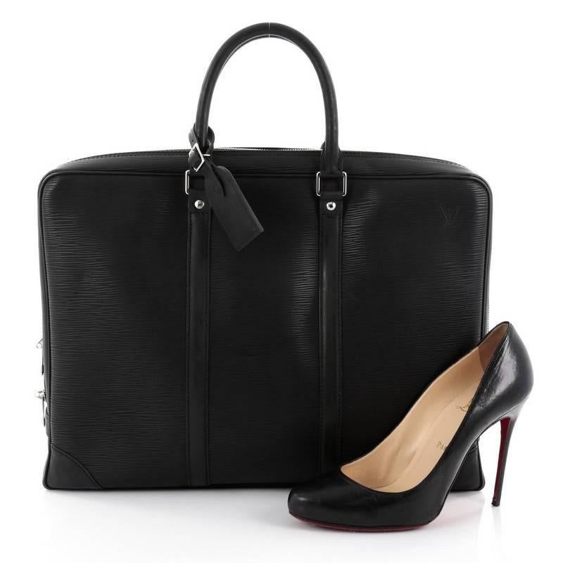This authentic Louis Vuitton Porte-Documents Voyage Briefcase Epi Leather updates its traditional men's briefcase with a luxurious and urban spin. Crafted in black epi leather, this functional, contemporary bag features a flat silhouette,
