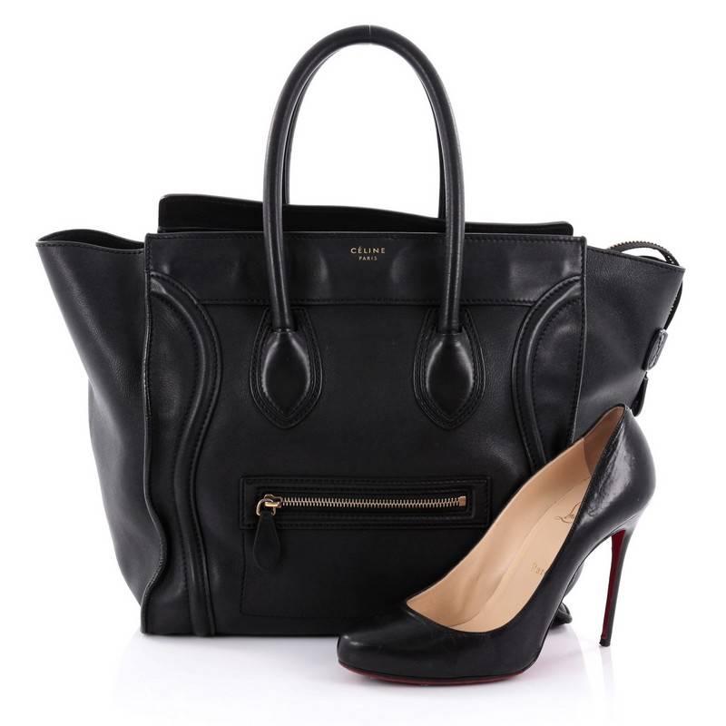 This authentic Celine Luggage Handbag Smooth Leather Mini epitomizes Phoebe Philo's minimalist yet chic style. Constructed in black smooth leather, this beloved fashionista's bag features dual-rolled leather handles, a frontal zip pocket, protective