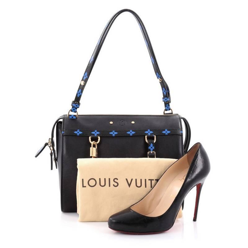 This authentic Louis Vuitton Speedy Amazon Bag Leather with Monogram Canvas MM is from the brands' Spring/Summer 2016 Collection that is an updated version of the iconic Speedy Bag. Crafted from black leather with blue monogram canvas trims, this