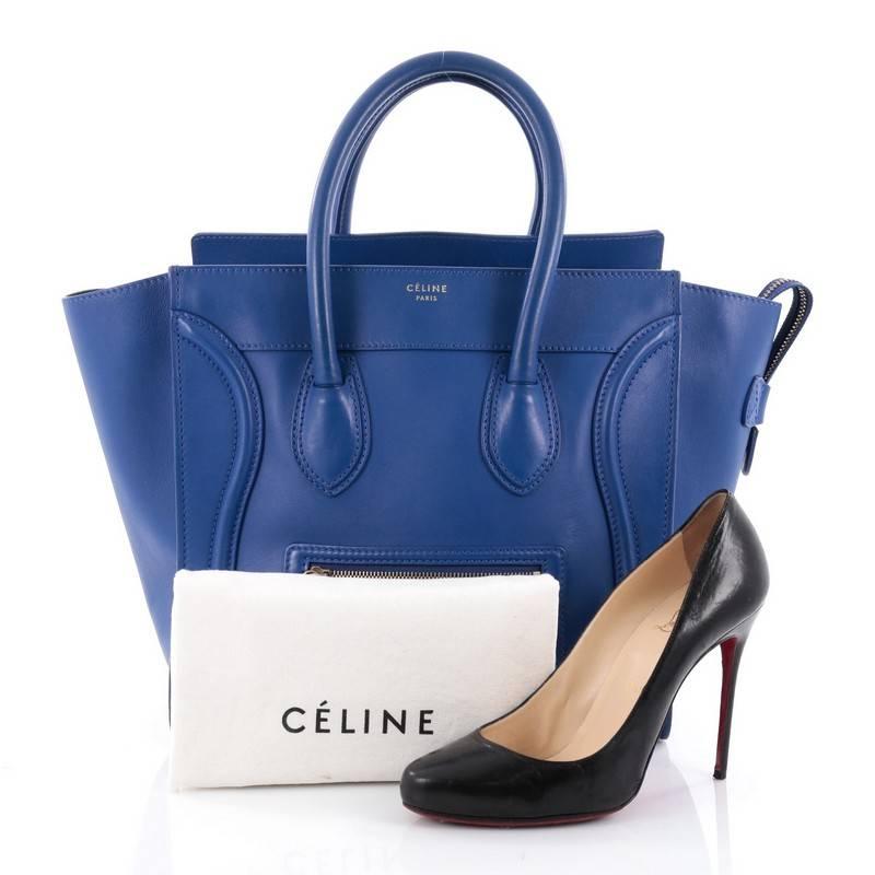 This authentic Celine Luggage Handbag Smooth Leather Mini epitomizes Phoebe Philo's minimalist yet chic style. Constructed in blue smooth leather, this beloved fashionista's bag features dual-rolled leather handles, a frontal zip pocket, Celine's