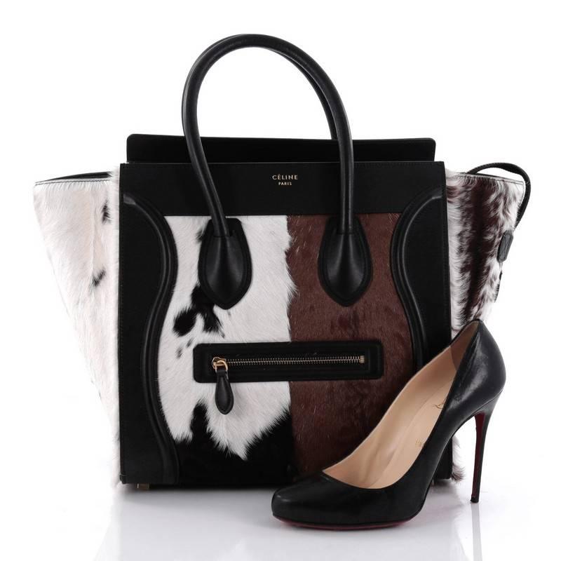 This authentic Celine Luggage Handbag Goat Fur Mini epitomizes Phoebe Philo's minimalist yet chic style. Constructed in white, brown and black goat fur with black leather, this beloved fashionista's bag features dual-rolled leather handles, a