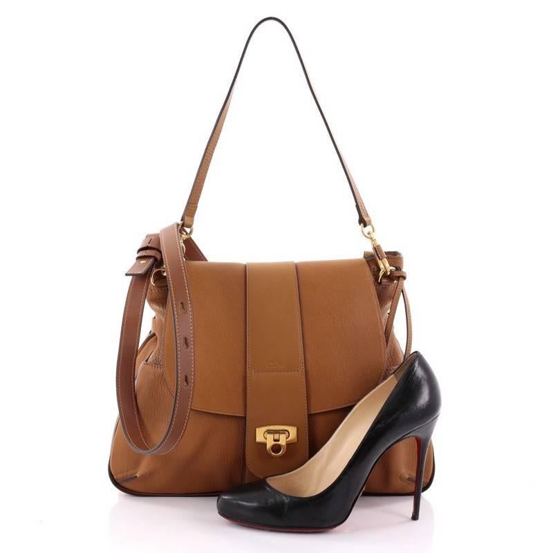 This authentic Chloe Lexa Crossbody Bag Leather Medium is perfect for your fall wardrobe. Crafted in brown leather, this bag features long leather shoulder strap, belted panel, exterior back pocket, two front flap pockets and gold-tone hardware