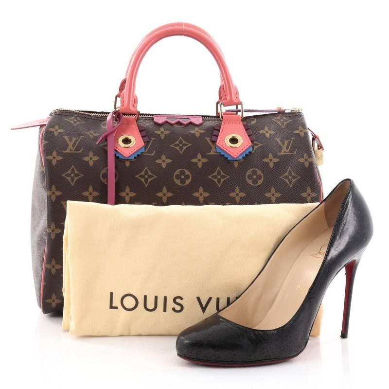 This authentic Louis Vuitton Speedy Handbag Limited Edition Totem Monogram Canvas 30, presented in the brand's Fall/Winter 2015 Collection, updates its classic Speedy with playful styling and inspired by Gaston Vuitton's African tribal masks.