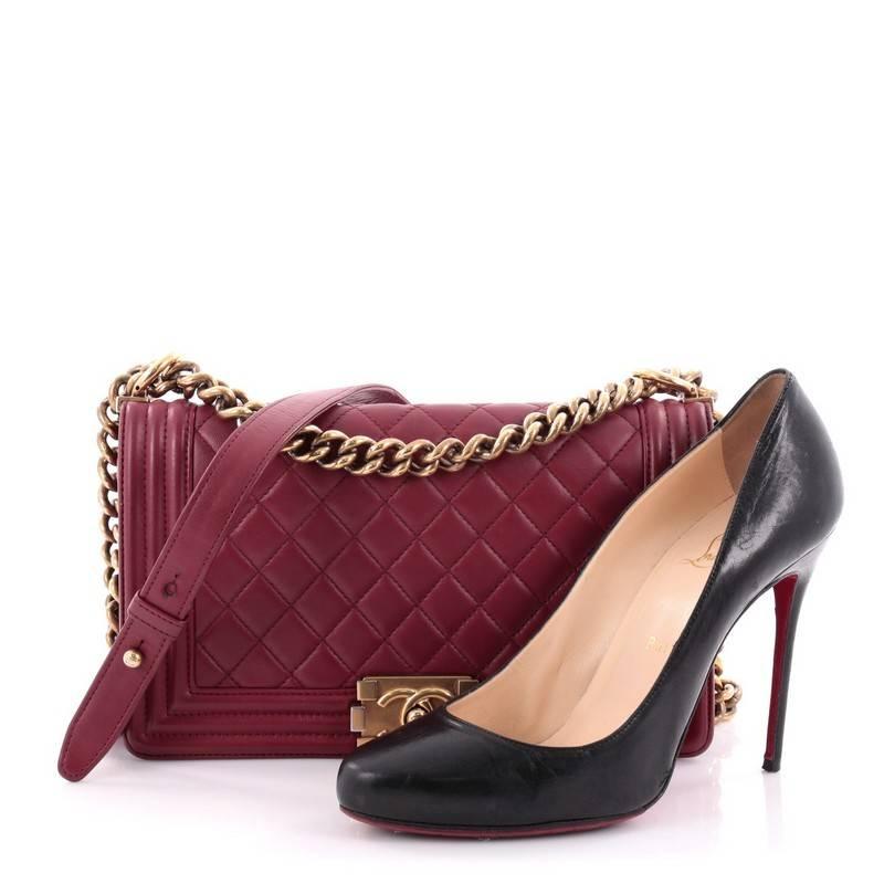 This authentic Chanel Boy Flap Bag Quilted Lambskin Old Medium is every woman's dream. Crafted from luxurious dark red diamond quilted lambskin leather, this popular, enviable Boy flap bag features a chunky chain link strap with leather shoulder