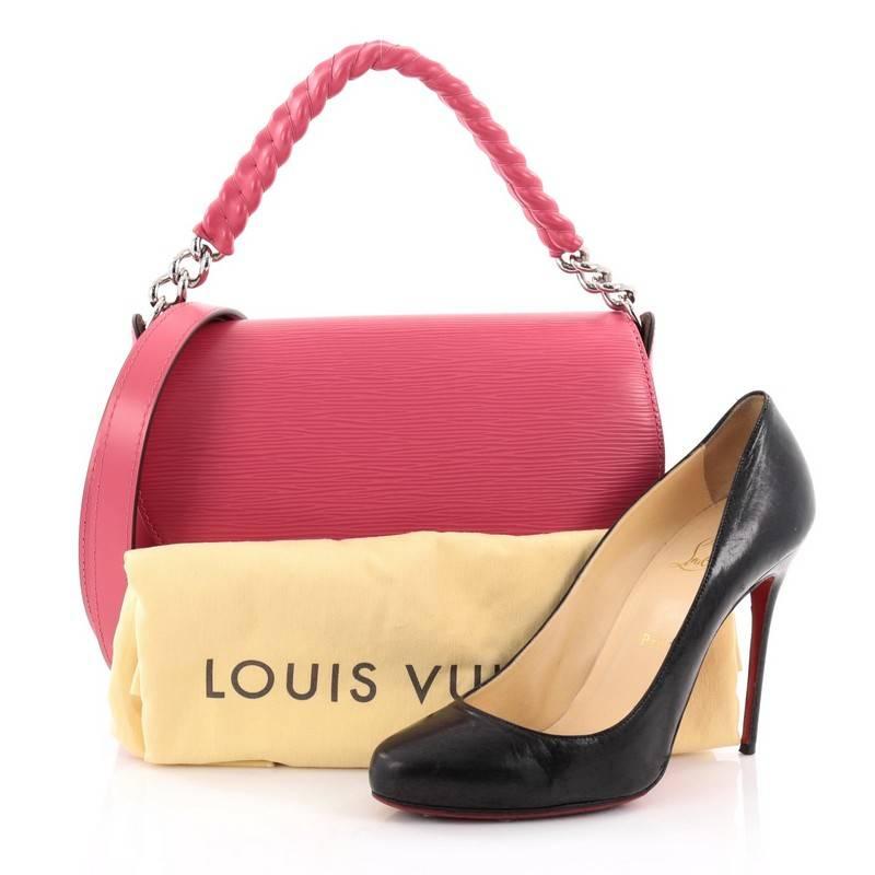This authentic Louis Vuitton Luna Handbag Epi Leather is a chic and sophisticated everyday bag to carry all your daily essentials. Crafted in pink epi leather, this bag features a structured and sleek shape, chain-link handle covered in sheepskin,