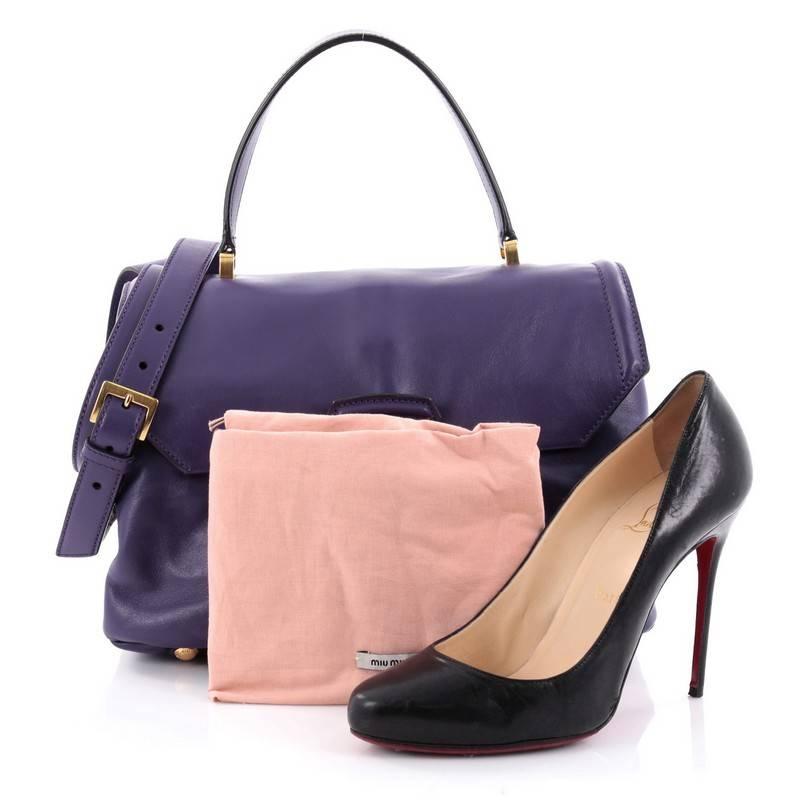This authentic Miu Miu Convertible Flap Top Handle Bag Vitello Soft Small is minimalist and sophisticated in design, perfect for everyday work. Crafted in purple vitello leather, this flap bag features single loop leather handle, detachable strap,