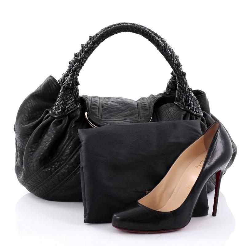 This authentic Fendi Spy Bag Leather showcases one of the brand's most popular designs. Constructed from black leather, this alluring bag features spiked braided woven leather handles, pleated silhouette, a 