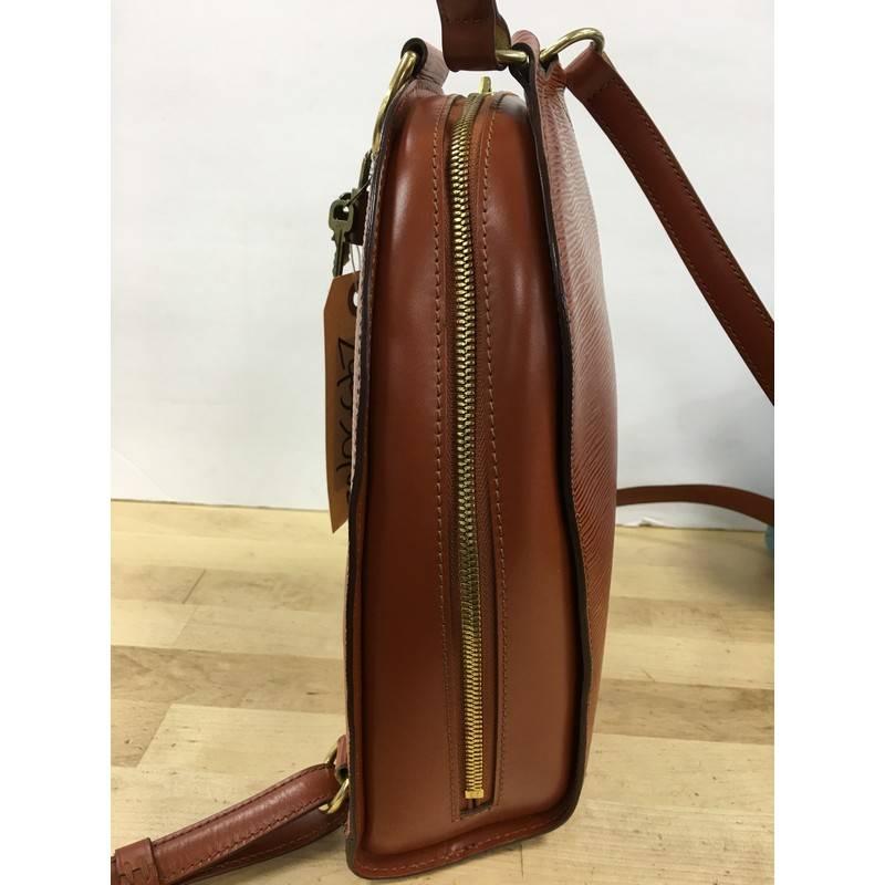 This authentic Louis Vuitton Mabillon Backpack Epi Leather is a perfect piece of work for on-the-go moments. Crafted from brown epi leather, this backpack features subtle stamped LV logo, exterior back zip pocket, dual adjustable shoulder straps,