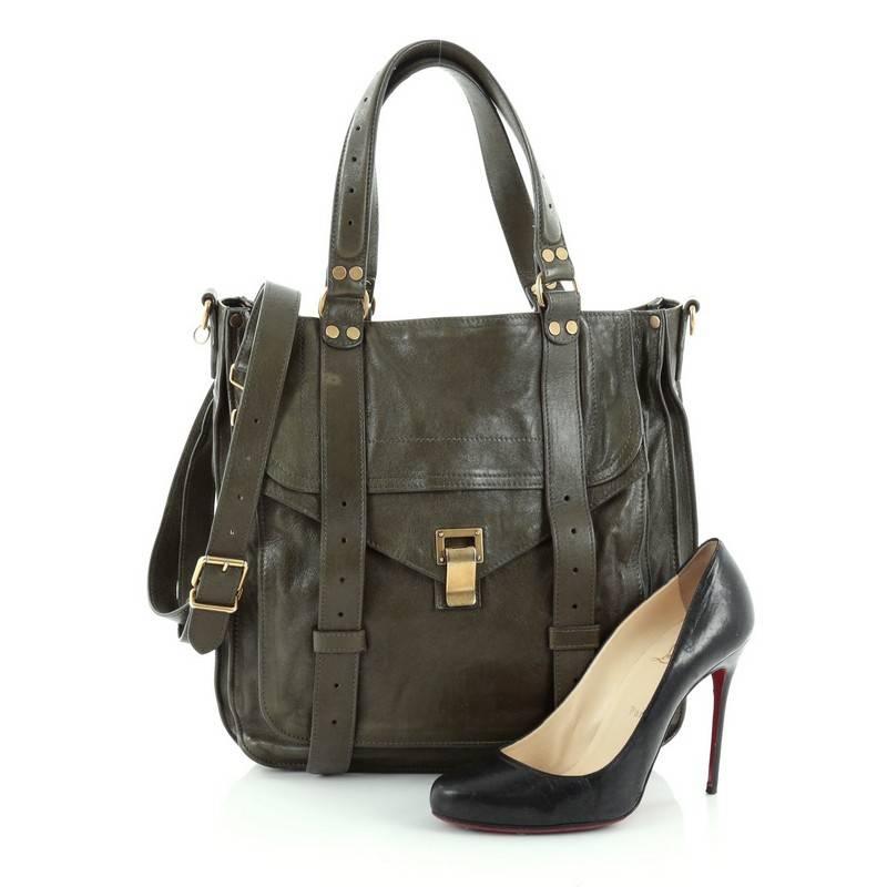 This authentic Proenza Schouler PS1 Convertible Tote Leather is ideal way to travel with style and functionality. Constructed in an army green leather, this popular tote features dual flat leather handles, a detachable shoulder strap, a large front