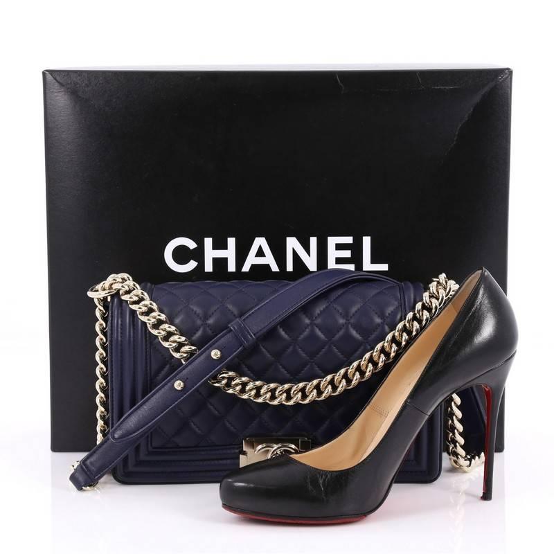 This authentic Chanel Boy Flap Bag Quilted Lambskin Old Medium is every woman's dream. Crafted from luxurious navy diamond quilted lambskin leather, this popular, enviable Boy flap bag features a chunkly chain link strap with leather shoulder pad,