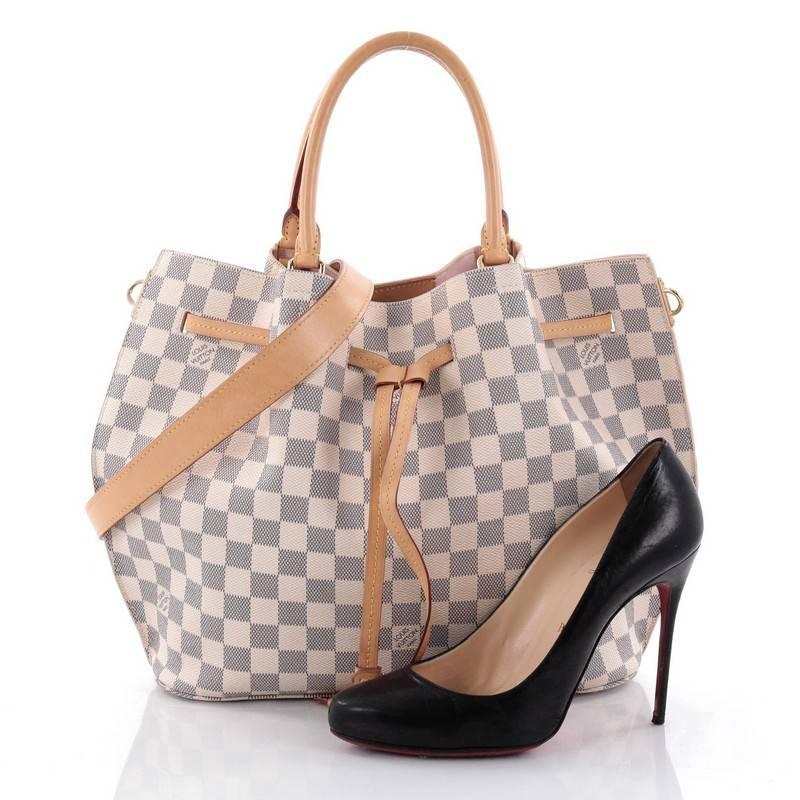 This authentic Louis Vuitton Girolata Handbag Damier is a practical and functional tote for everyday use. Constructed with Louis Vuitton's signature damier azur coated canvas, this tote is spacious and structured without being bulky and features
