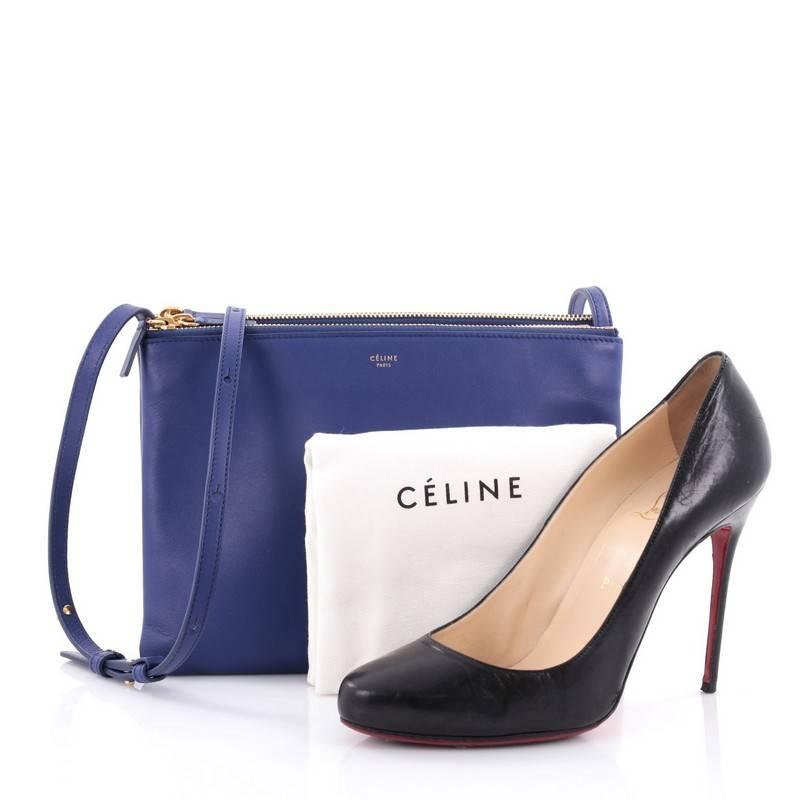 This authentic Celine Trio Crossbody Bag Leather Small is a playful minimalist bag to carry for on-the-go moments. Crafted in royal blue leather, this petite crossbody features adjustable shoulder strap, gold tonal snap buttons that easily detached